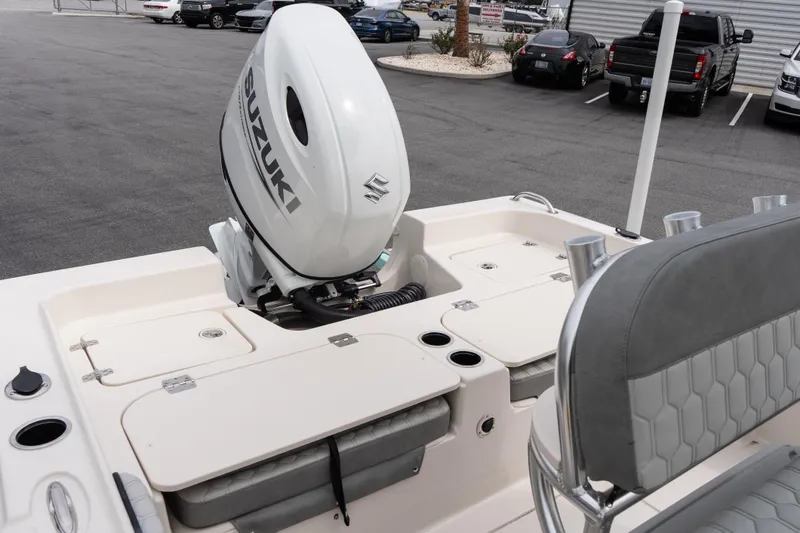 Slide: The Image of 2026 Carolina Skiff 21 Ultra Elite boat with Suzuki outboard motor, parked in a lot. - 8