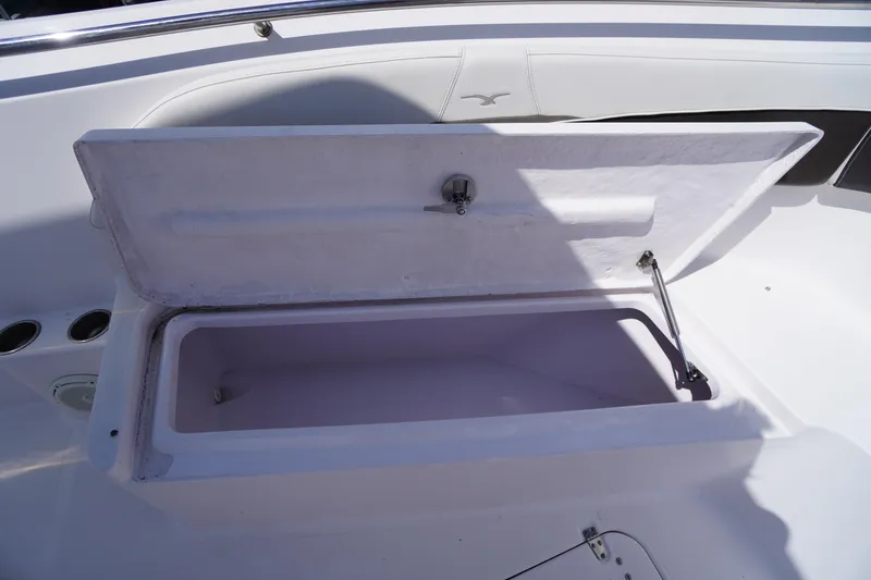 Slide: The Image of Open storage compartment on 2016 Pro-Line 29 Grand Sport boat. - 15