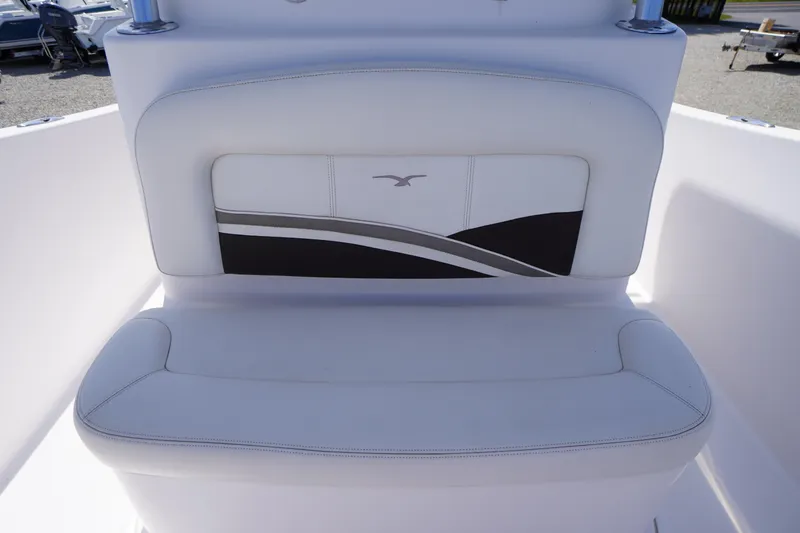 Slide: The Image of 2016 Pro-Line 29 Grand Sport boat seat with elegant white and black design. - 17