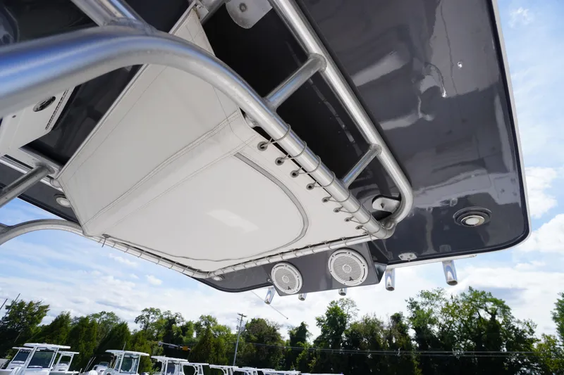 Slide: The Image of 2016 Pro-Line 29 Grand Sport boat canopy with speakers and metal framework. - 3