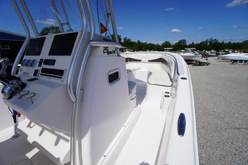 Slide: The Image of 2016 Pro-Line 29 Grand Sport boat with sleek design and modern cockpit controls. - 33