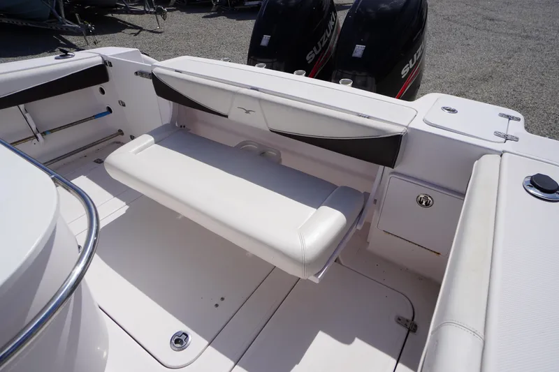 Slide: The Image of 2016 Pro-Line 29 Grand Sport boat interior with seating and Suzuki outboard engines. - 43