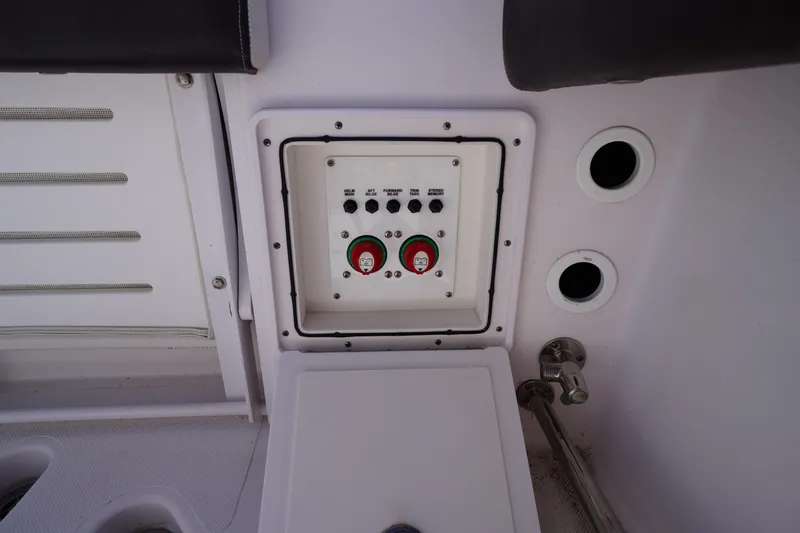 Slide: The Image of Control panel on a 2016 Pro-Line 29 Grand Sport boat interior. - 47