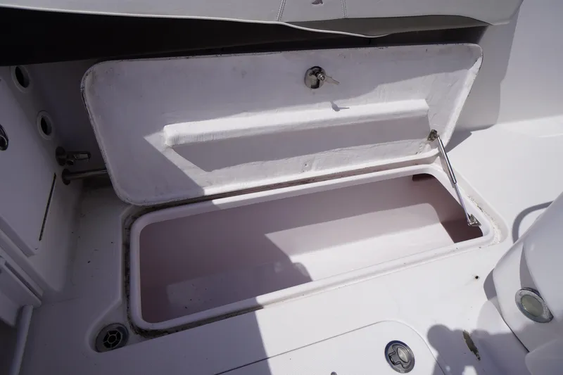 Slide: The Image of Open storage compartment on 2016 Pro-Line 29 Grand Sport boat. - 50