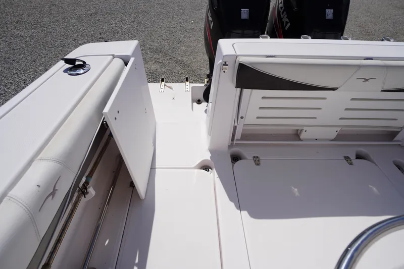 Slide: The Image of 2016 Pro-Line 29 Grand Sport boat interior with dual Suzuki engines. - 55