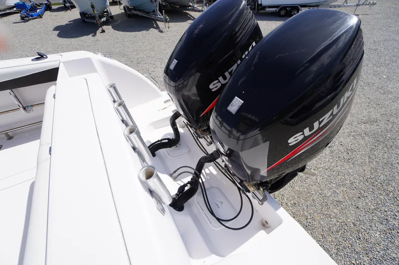 Slide: The Image of 2016 Pro-Line 29 Grand Sport boat with dual Suzuki outboard engines. - 56