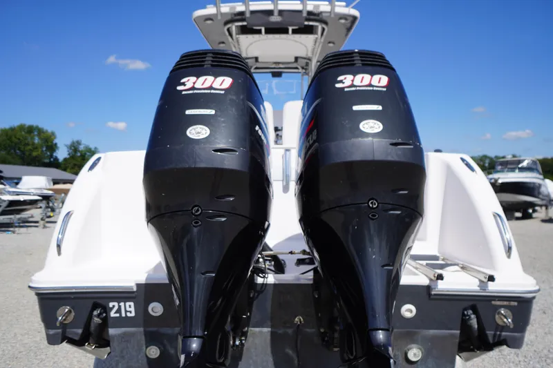 Slide: The Image of 2016 Pro-Line 29 Grand Sport boat with twin 300 horsepower outboard engines. - 57
