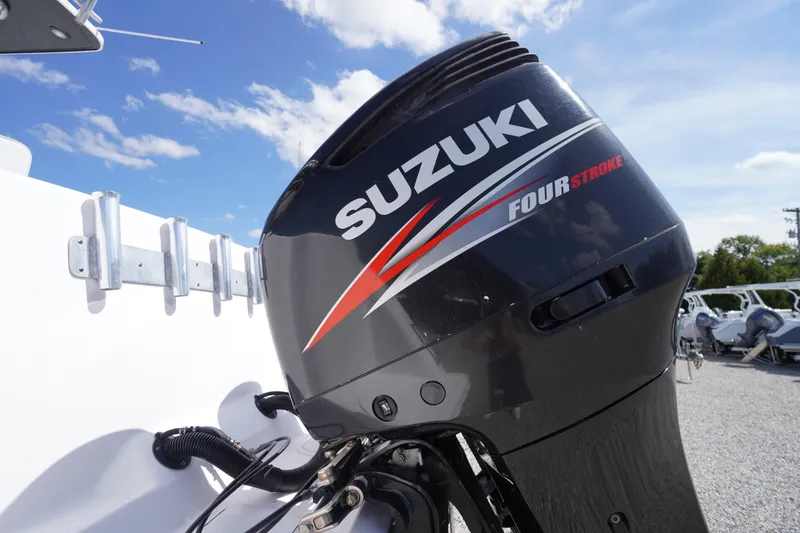Slide: The Image of Suzuki four-stroke outboard motor on 2016 Pro-Line 29 Grand Sport boat. - 59