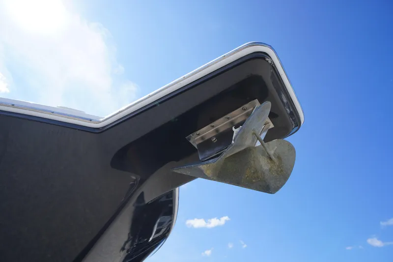 Slide: The Image of 2016 Pro-Line 29 Grand Sport boat anchor against clear blue sky. - 6