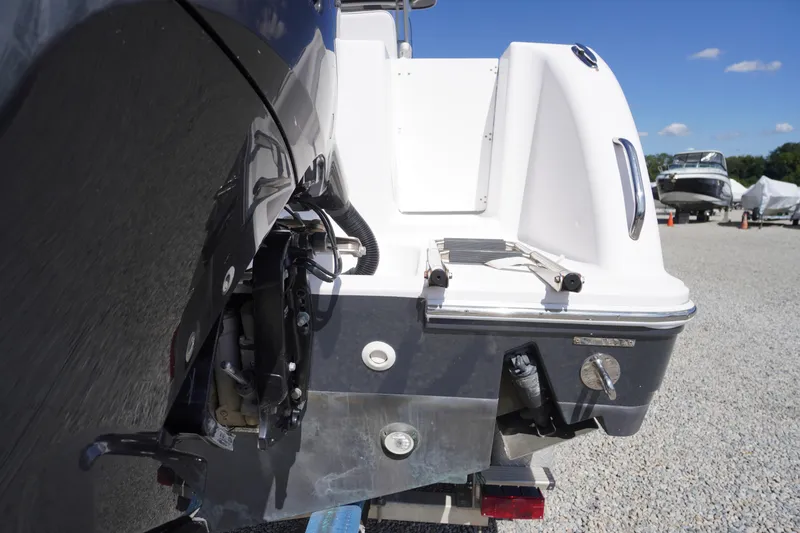 Slide: The Image of 2016 Pro-Line 29 Grand Sport boat rear view in a sunny outdoor setting. - 62