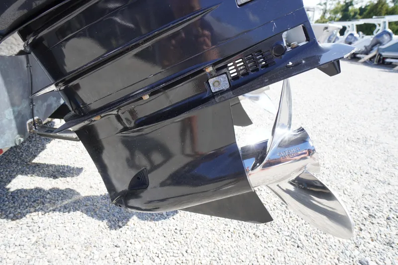 Slide: The Image of Close-up of a 2016 Pro-Line 29 Grand Sport boat propeller on gravel. - 64