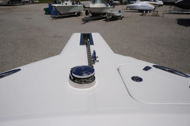 Slide: The Image of 2016 Pro-Line 29 Grand Sport boat deck with anchor chain mechanism. - 7