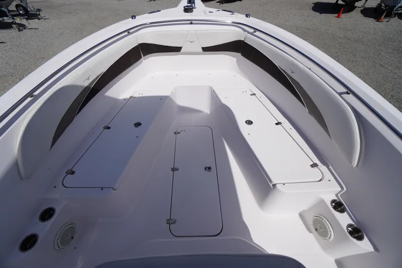 Slide: The Image of 2016 Pro-Line 29 Grand Sport boat interior with spacious seating and storage compartments. - 9