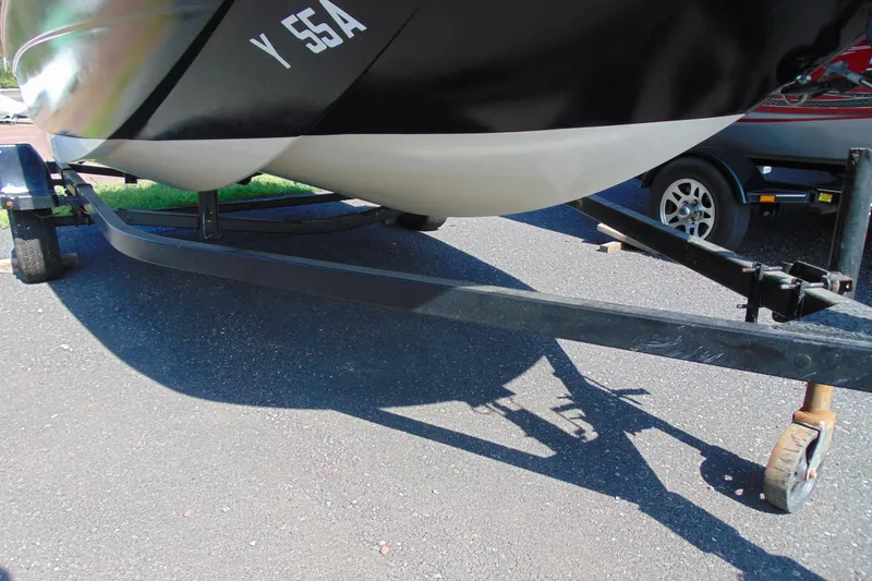 Slide: The Image of 2016 Bayliner 160 Element boat on trailer, parked on asphalt. - 11