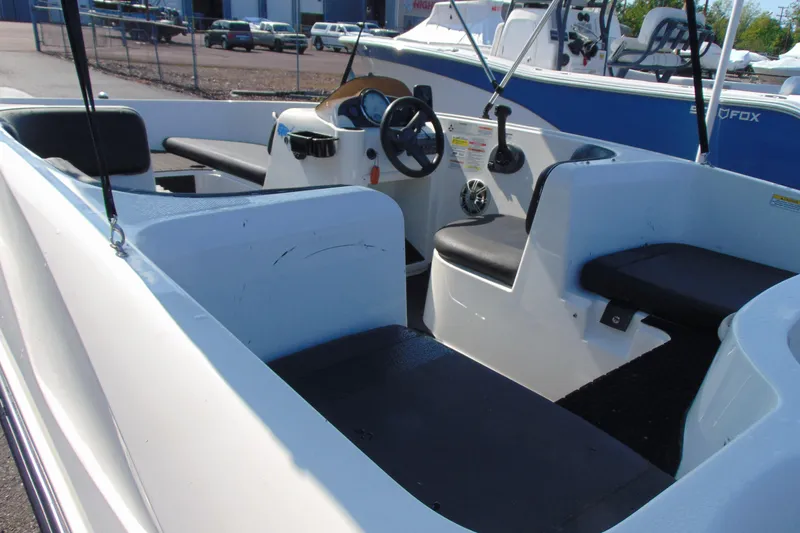Slide: The Image of 2016 Bayliner 160 Element boat interior with seating and steering wheel. - 6