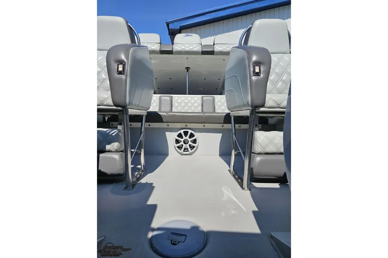 Slide: The Image of 2007 Donzi 35 ZR interior with gray quilted seats and speaker detail. - 101