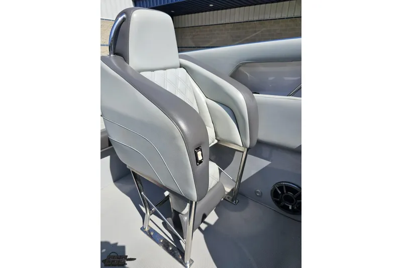 Slide: The Image of 2007 Donzi 35 ZR boat seat with gray upholstery and stainless steel frame. - 104