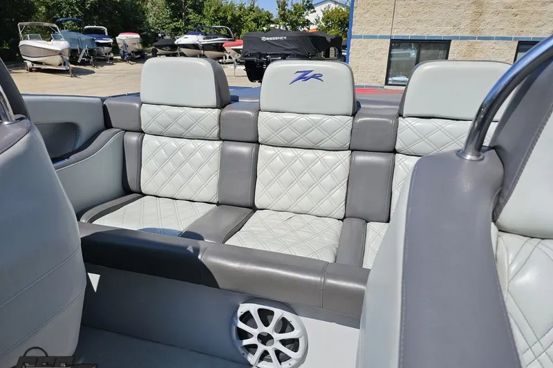 Slide: The Image of 2007 Donzi 35 ZR boat interior with gray quilted seats and speaker. - 105