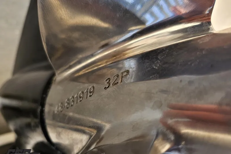 Slide: The Image of Close-up of a 2007 Donzi 35 ZR boat propeller with engraved serial number. - 111