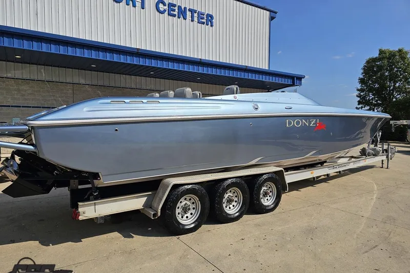 Slide: The Image of 2007 Donzi 35 ZR speedboat on trailer outside a marine center. - 16