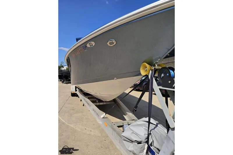 Slide: The Image of 2007 Donzi 35 ZR boat on trailer under clear blue sky. - 19
