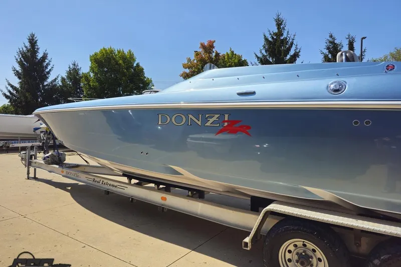 Slide: The Image of 2007 Donzi 35 ZR speedboat on trailer, sleek design, blue exterior. - 30