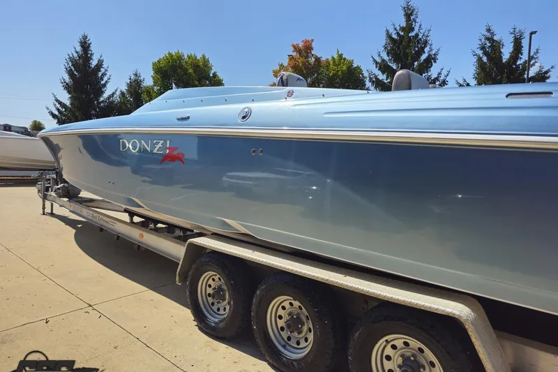 Slide: The Image of 2007 Donzi 35 ZR speedboat on a trailer, parked outdoors. - 33