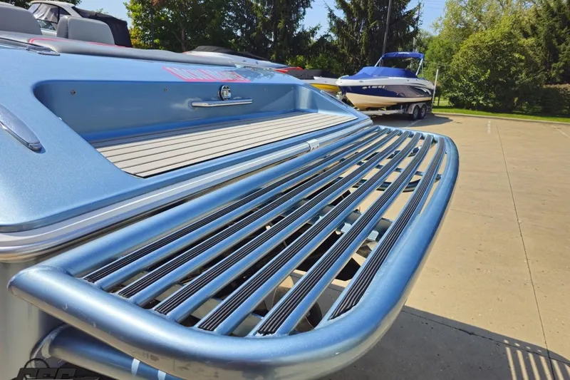 Slide: The Image of 2007 Donzi 35 ZR boat with sleek metallic finish and rear deck detail. - 36