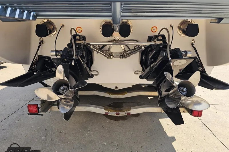 Slide: The Image of Rear view of a 2007 Donzi 35 ZR boat showing dual propellers and outboard motors. - 39