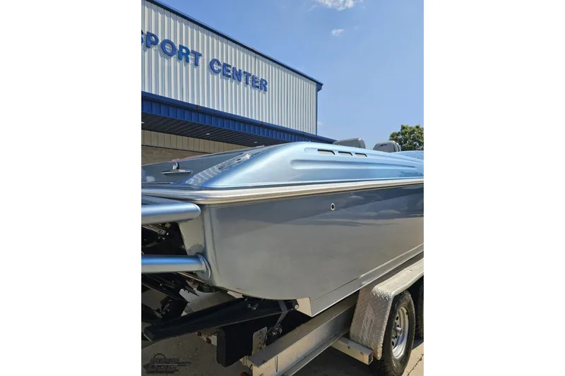Slide: The Image of 2007 Donzi 35 ZR boat on trailer outside a sport center. - 41
