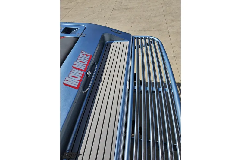 Slide: The Image of 2007 Donzi 35 ZR boat with "Now Money" decal on blue deck. - 46