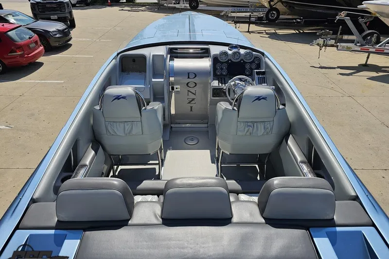 Slide: The Image of 2007 Donzi 35 ZR boat interior with sleek seating and modern dashboard controls. - 53