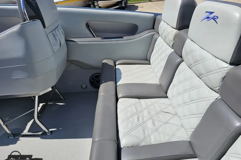 Slide: The Image of 2007 Donzi 35 ZR boat interior with gray quilted leather seats and ZR logo. - 59