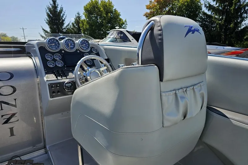 Slide: The Image of 2007 Donzi 35 ZR boat cockpit with steering wheel and instrument panel. - 60