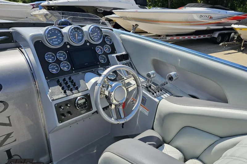 Slide: The Image of Interior of a 2007 Donzi 35 ZR boat with sleek dashboard and controls. - 65