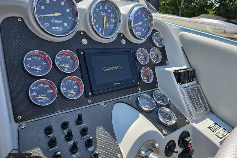 Slide: The Image of Dashboard of a 2007 Donzi 35 ZR boat with Garmin navigation system and Livorsi gauges. - 71