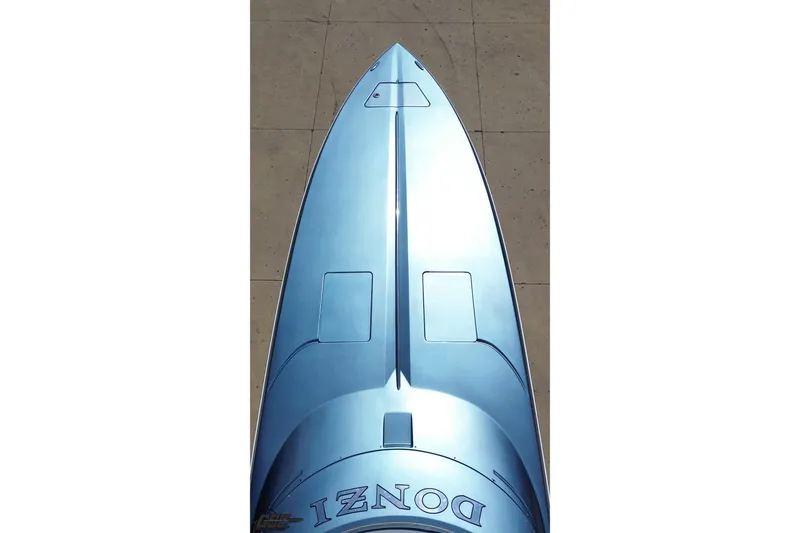 Slide: The Image of Top view of a sleek 2007 Donzi 35 ZR boat with a glossy blue finish. - 77