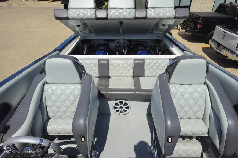 Slide: The Image of 2007 Donzi 35 ZR boat interior with quilted seats and open engine compartment. - 80