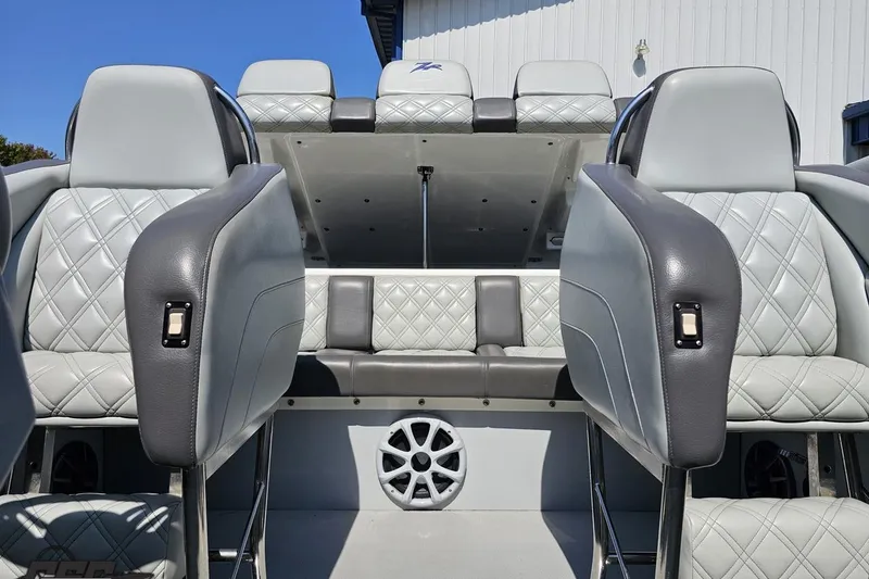 Slide: The Image of 2007 Donzi 35 ZR boat interior with quilted gray seating and speaker detail. - 81