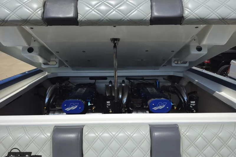 Slide: The Image of Engine compartment of a 2007 Donzi 35 ZR boat, showcasing dual engines. - 82
