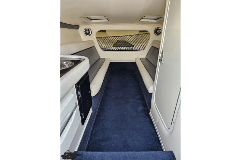 Slide: The Image of Interior of 2007 Donzi 35 ZR boat with seating and carpeted floor. - 89
