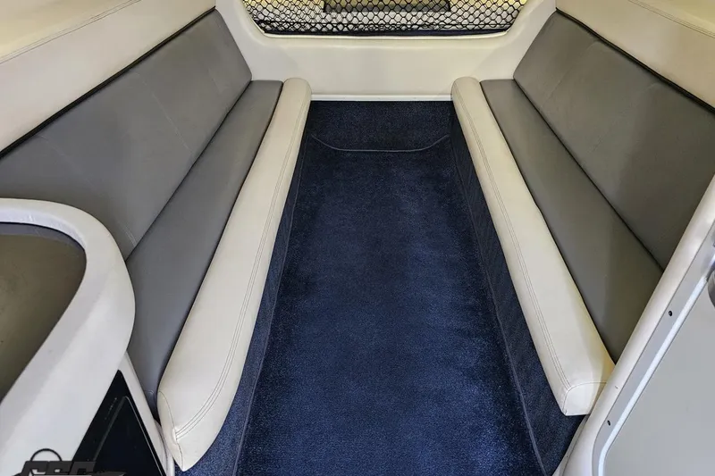 Slide: The Image of Interior cabin of a 2007 Donzi 35 ZR boat with cushioned seating. - 91
