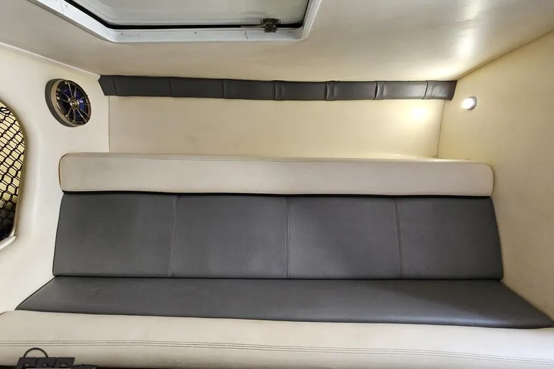 Slide: The Image of 2007 Donzi 35 ZR cabin interior with cushioned seating and ambient lighting. - 98