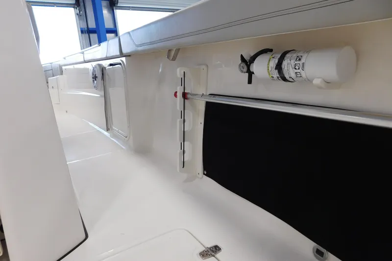 Slide: The Image of 2022 Pursuit S 328 Sport boat interior with safety equipment and sleek design. - 14