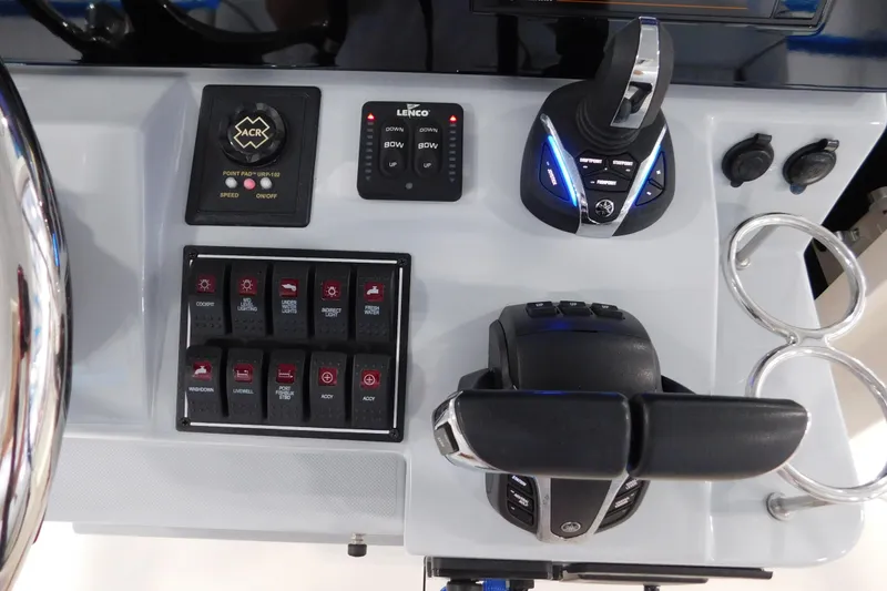 Slide: The Image of Control panel of 2022 Pursuit S 328 Sport boat with switches and throttle. - 29