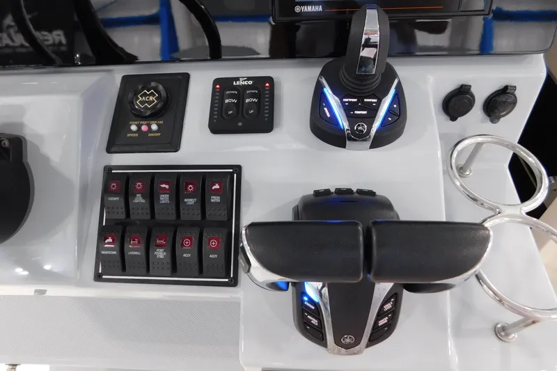 Slide: The Image of Control panel of 2022 Pursuit S 328 Sport boat with Yamaha controls and switches. - 32