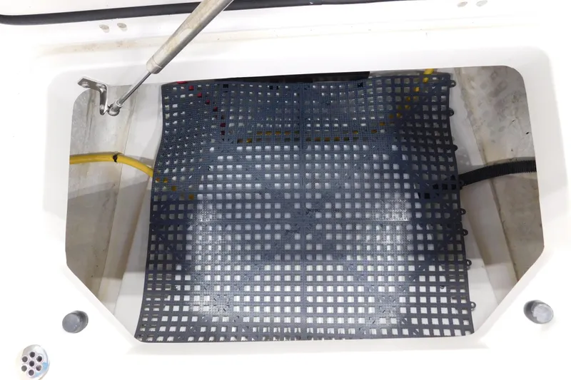 Slide: The Image of 2022 Pursuit S 328 Sport boat compartment with grid mat and hydraulic support. - 47