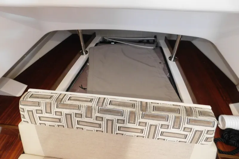 Slide: The Image of Interior view of 2022 Pursuit S 328 Sport boat with patterned seating and storage area. - 53
