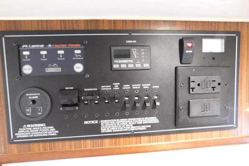 Slide: The Image of Control panel of 2022 Pursuit S 328 Sport boat with various switches and indicators. - 54