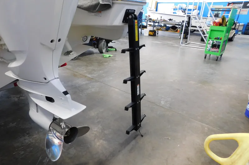 Slide: The Image of 2022 Pursuit S 328 Sport boat with ladder in a workshop setting. - 77